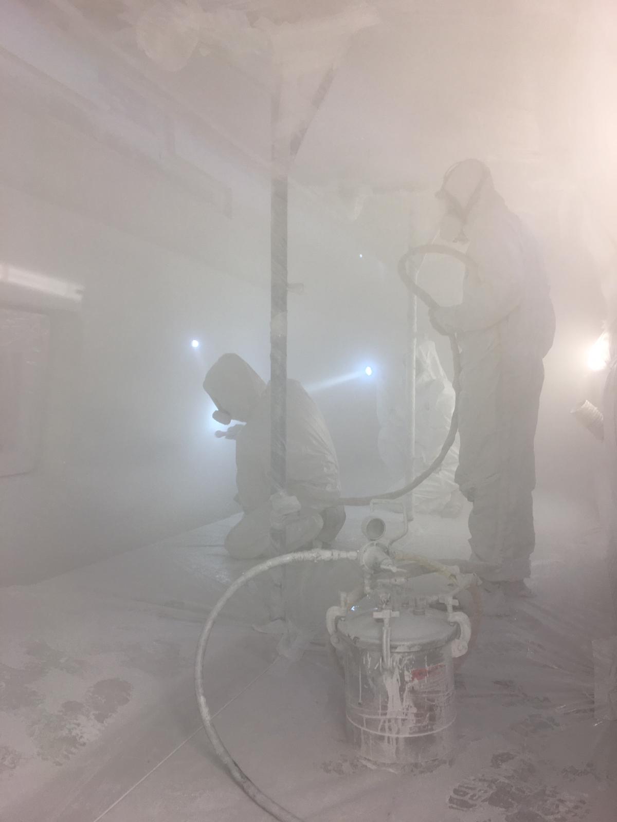 Universe Yachting team painting topcoat paint